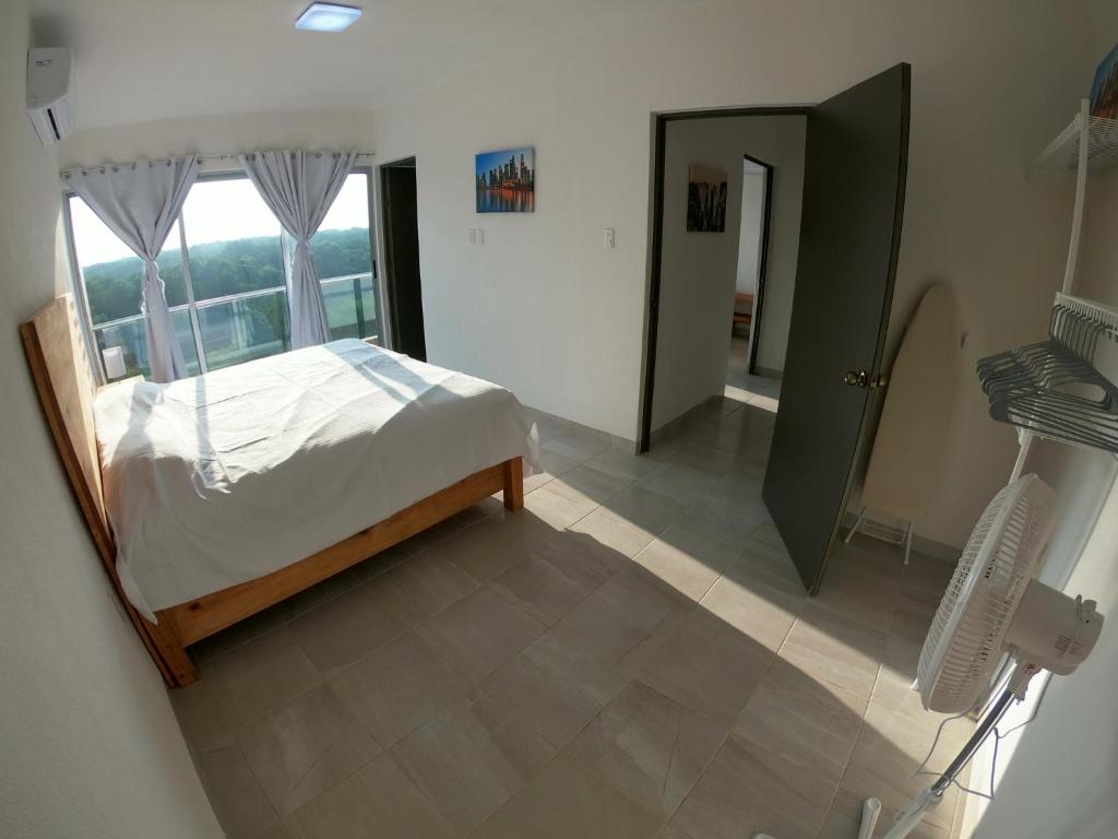 Postel nebo postele na pokoji v ubytování Boca PentHouses - Tampiquera
