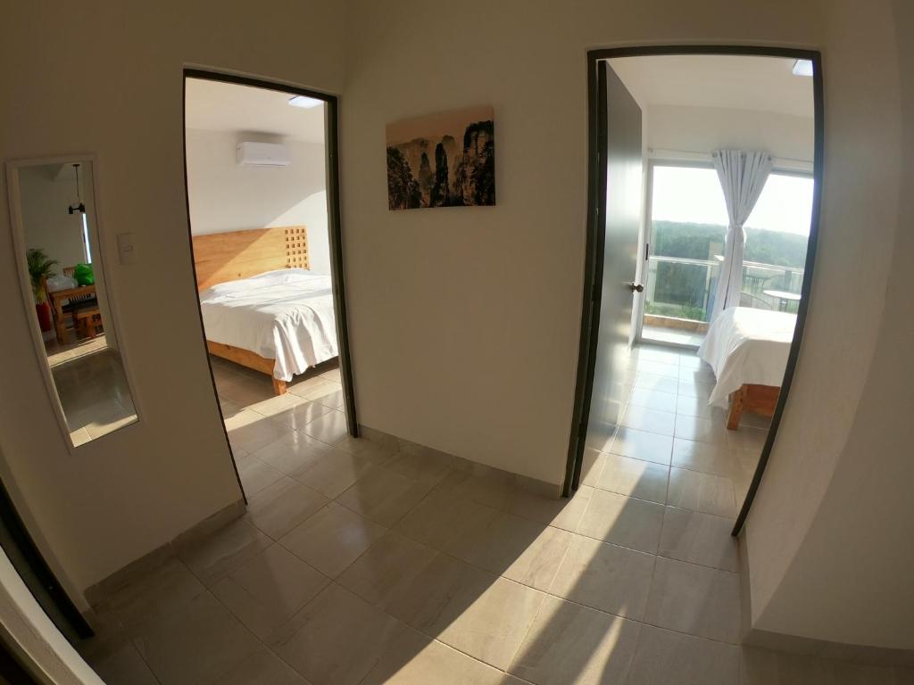 Postel nebo postele na pokoji v ubytování Boca PentHouses - Tampiquera