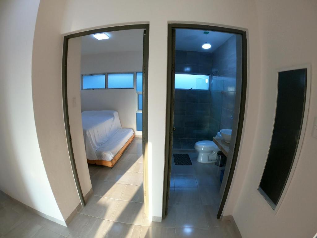 Postel nebo postele na pokoji v ubytování Boca PentHouses - Tampiquera
