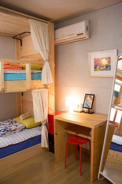 Postel nebo postele na pokoji v ubytování Tong Stay