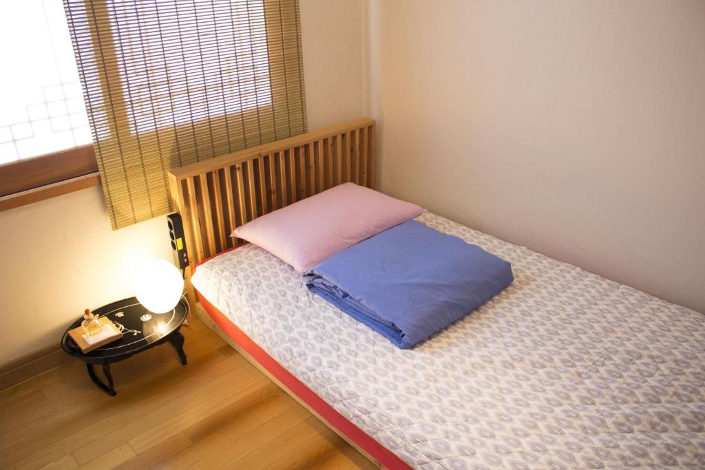 Postel nebo postele na pokoji v ubytování Tong Stay