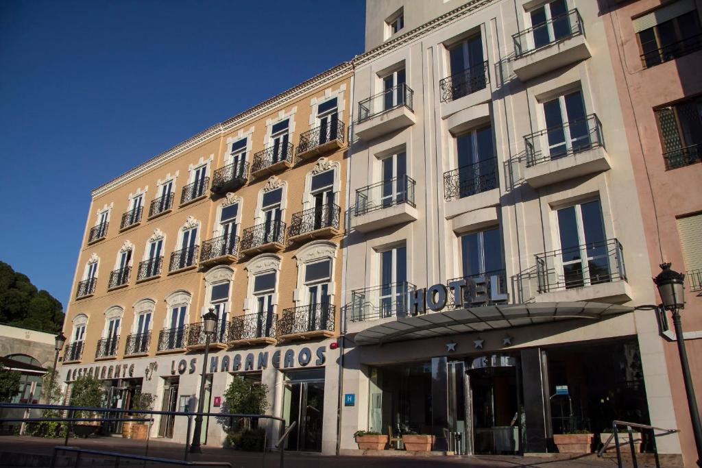 a large white building with a sign on it at Hotel Los Habaneros in Cartagena