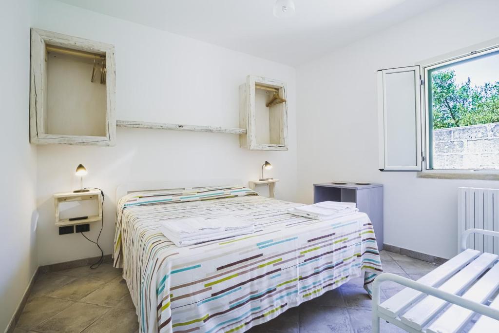 Postel nebo postele na pokoji v ubytování Bio Agriturismo Salos