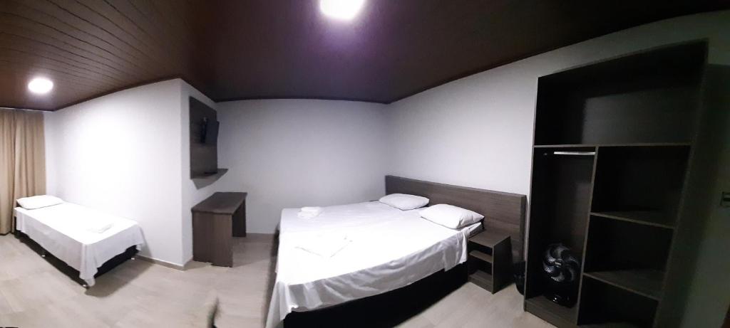 Postel nebo postele na pokoji v ubytování Hotel ROF