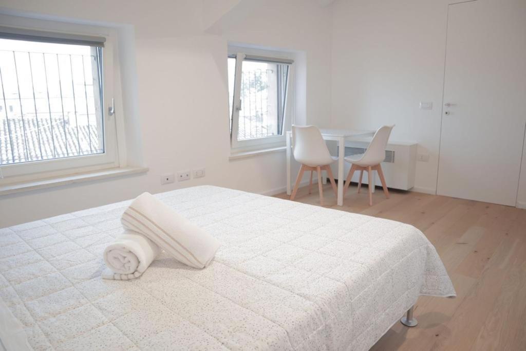 Ένα ή περισσότερα κρεβάτια σε δωμάτιο στο Residenze Mazzini