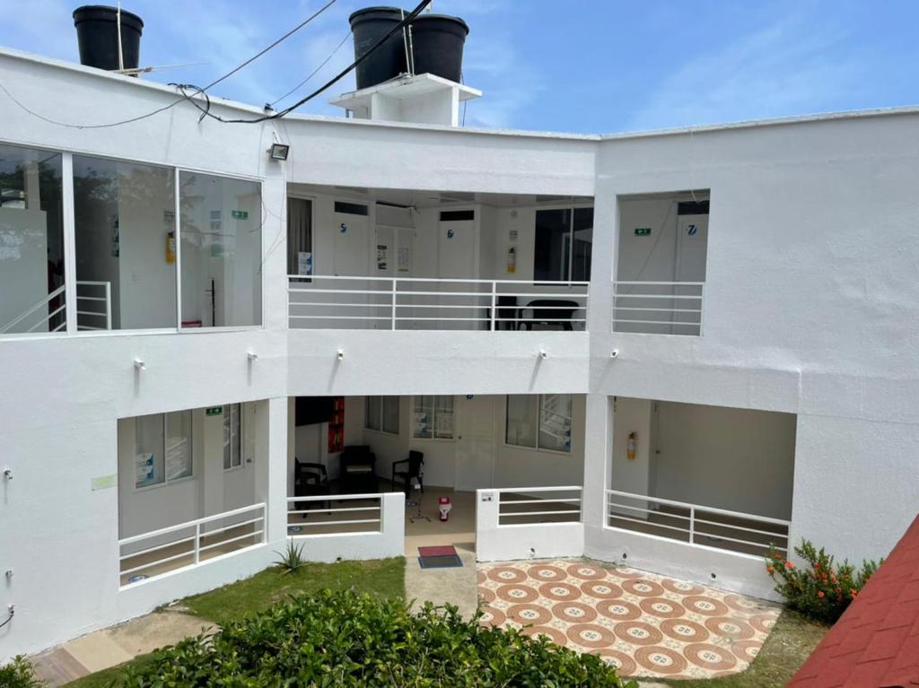 an external view of a white building at Hotel Olas in San Andrés