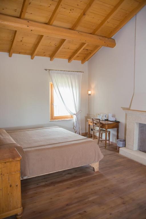 Postel nebo postele na pokoji v ubytování Cascina Girolda