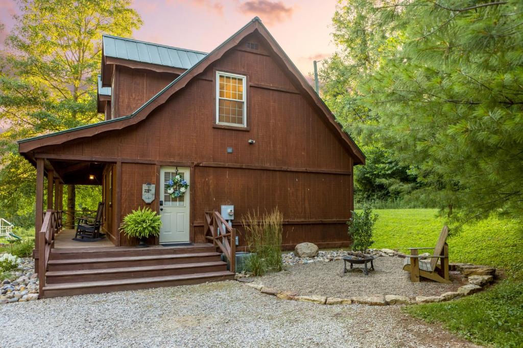 a barn house with a porch and a patio at White Pine . Trailside Lodging in Millersburg