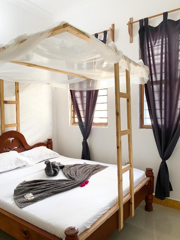 Postel nebo postele na pokoji v ubytování Lighthouse Guesthouse