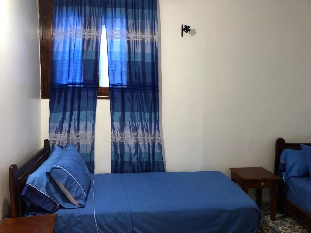 Llit o llits en una habitació de Hotel Nisrine