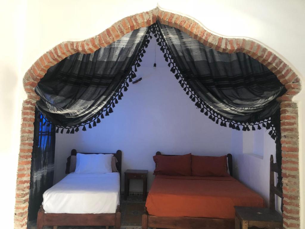 Llit o llits en una habitació de Hotel Nisrine