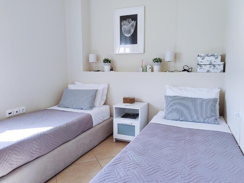 Postel nebo postele na pokoji v ubytování Comfy Apartment
