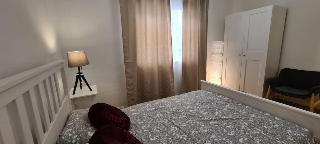 Łóżko lub łóżka w pokoju w obiekcie La Pergola