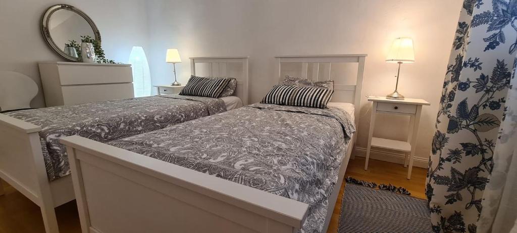 Łóżko lub łóżka w pokoju w obiekcie La Pergola