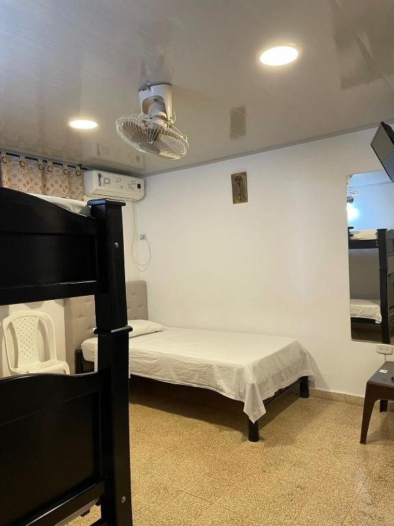 Postel nebo postele na pokoji v ubytování BOUTIQUE HOTEL BALOP Valledupar