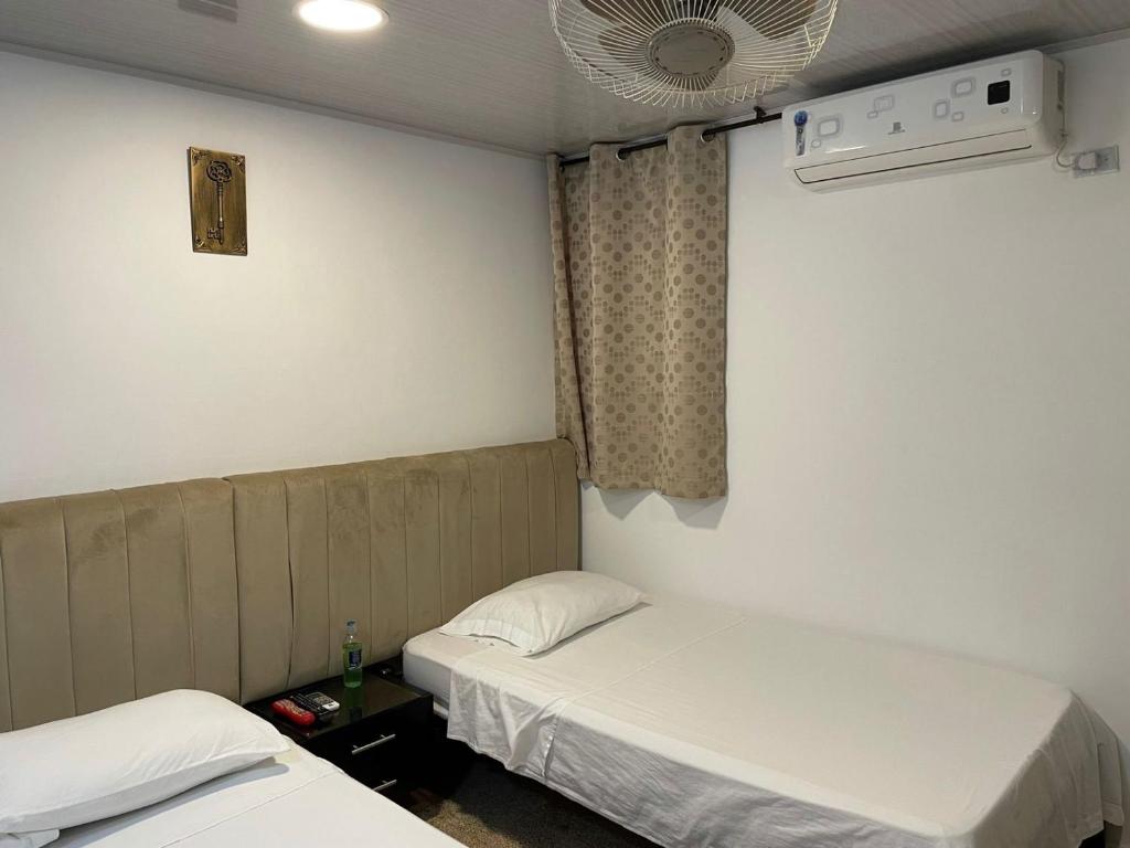 Postel nebo postele na pokoji v ubytování BOUTIQUE HOTEL BALOP Valledupar