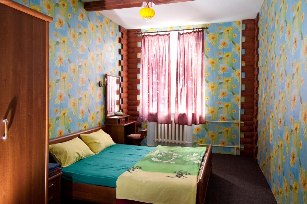 Postel nebo postele na pokoji v ubytování Apart-Hotel Parasolka