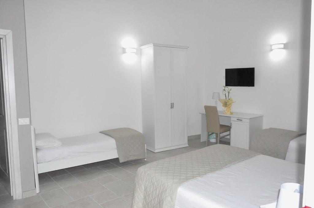 A bed or beds in a room at RELAIS SAN MARCO LUXURY GUEST HOUSE