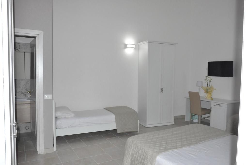 A bed or beds in a room at RELAIS SAN MARCO LUXURY GUEST HOUSE