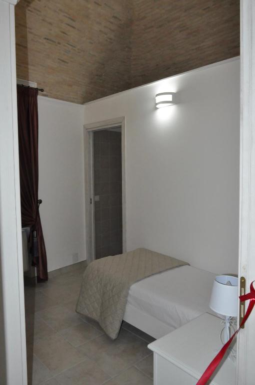 A bed or beds in a room at RELAIS SAN MARCO LUXURY GUEST HOUSE