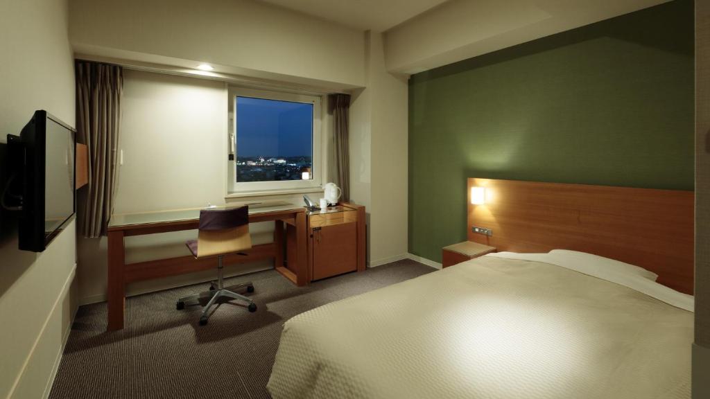 Postel nebo postele na pokoji v ubytování Candeo Hotels Handa