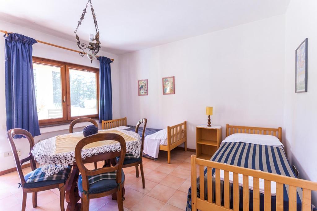 Postel nebo postele na pokoji v ubytování Agriturismo Cavendo Tutus