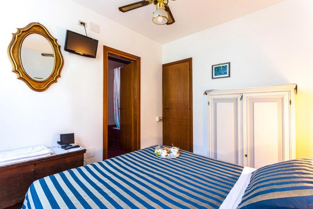Postel nebo postele na pokoji v ubytování Agriturismo Cavendo Tutus