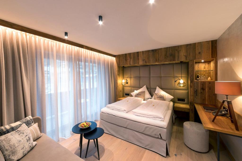 Postel nebo postele na pokoji v ubytování Aktivhotel Alpendorf