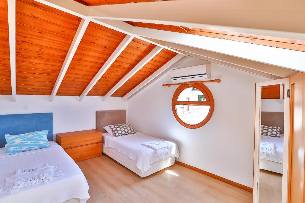 Postel nebo postele na pokoji v ubytování Çınarlar Apart Hotel KAŞ