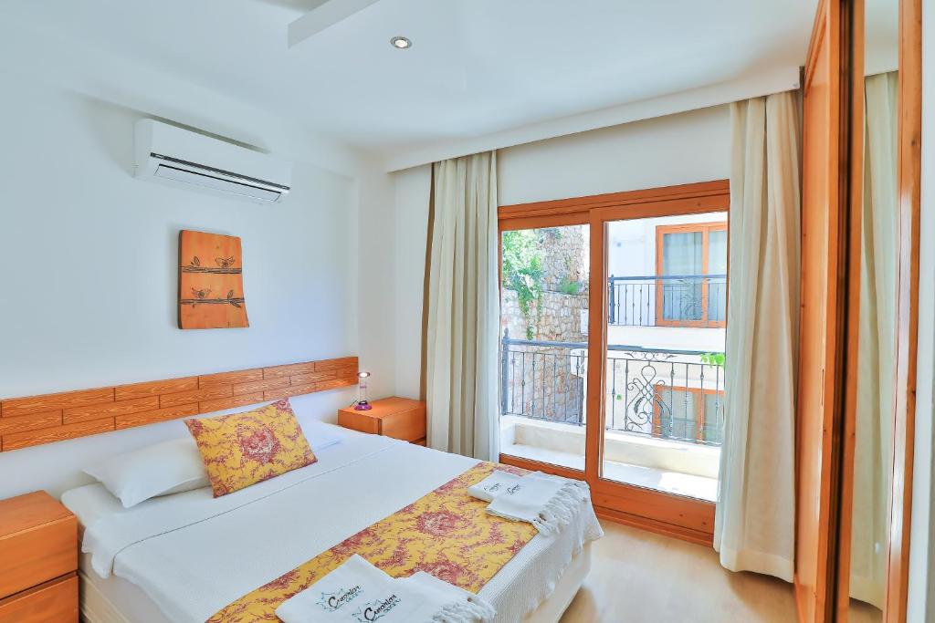 Postel nebo postele na pokoji v ubytování Çınarlar Apart Hotel KAŞ