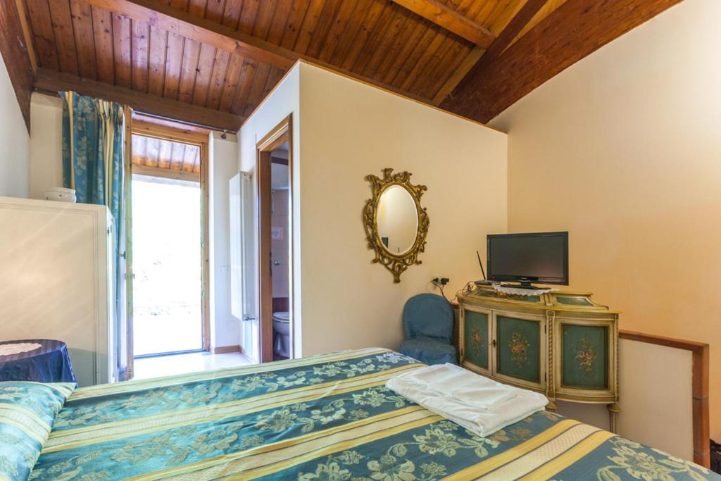 Postel nebo postele na pokoji v ubytování Agriturismo Cavendo Tutus
