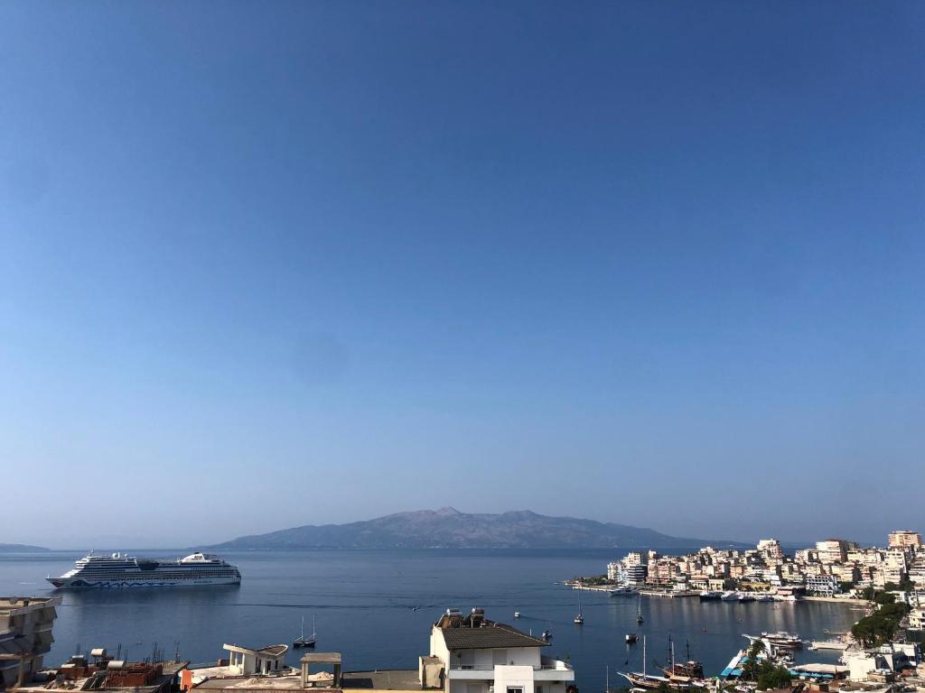 a view of a harbor with a cruise ship in the water at Hostel Andrey in Sarandë