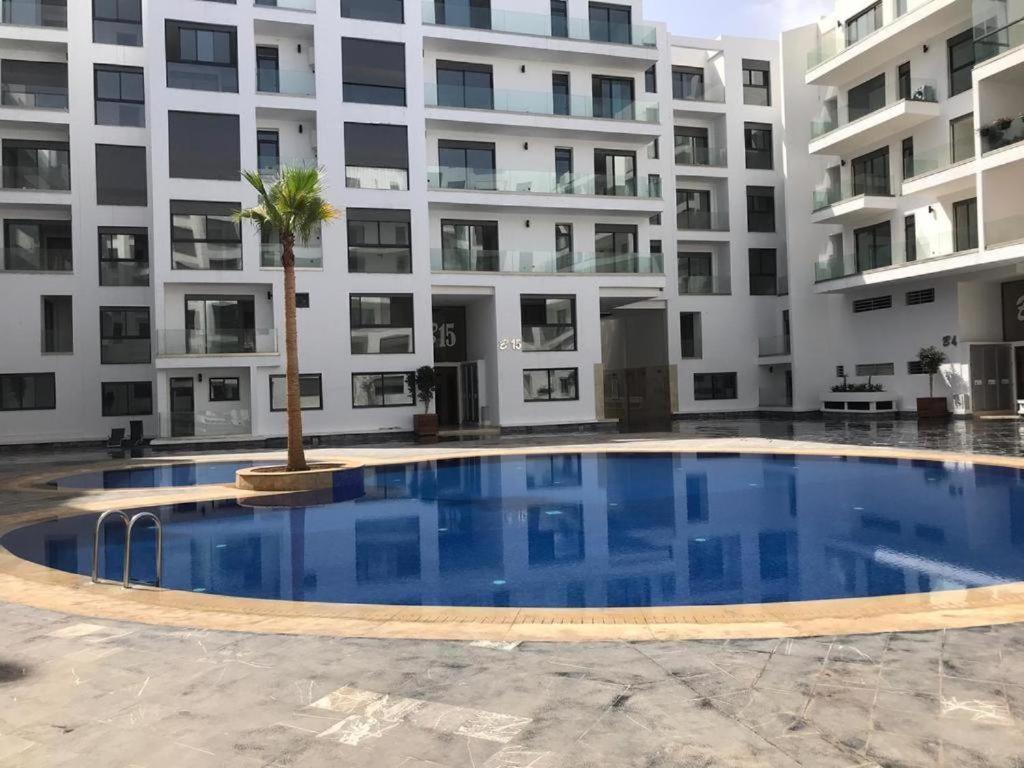 a large swimming pool in front of a building at AgadirBay in Agadir