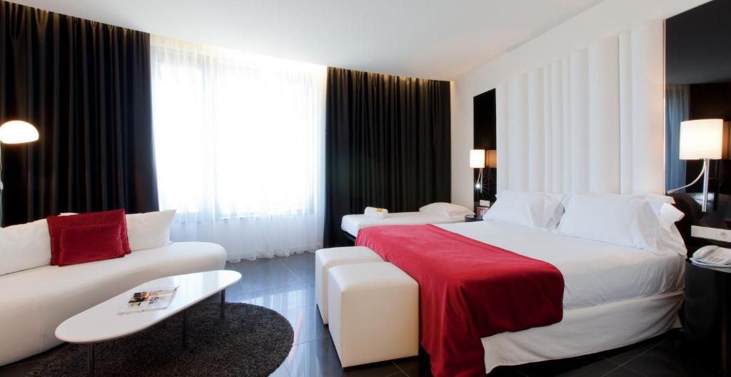 מיטה או מיטות בחדר ב-Hotel Porta Fira 4* Sup