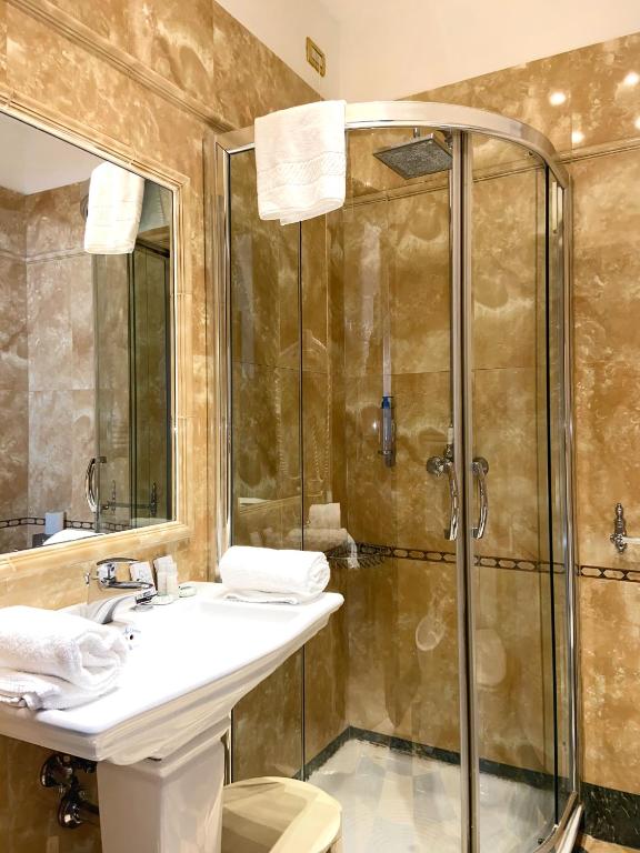 a bathroom with a shower and a sink and a toilet at Ca' Del Nobile in Venice