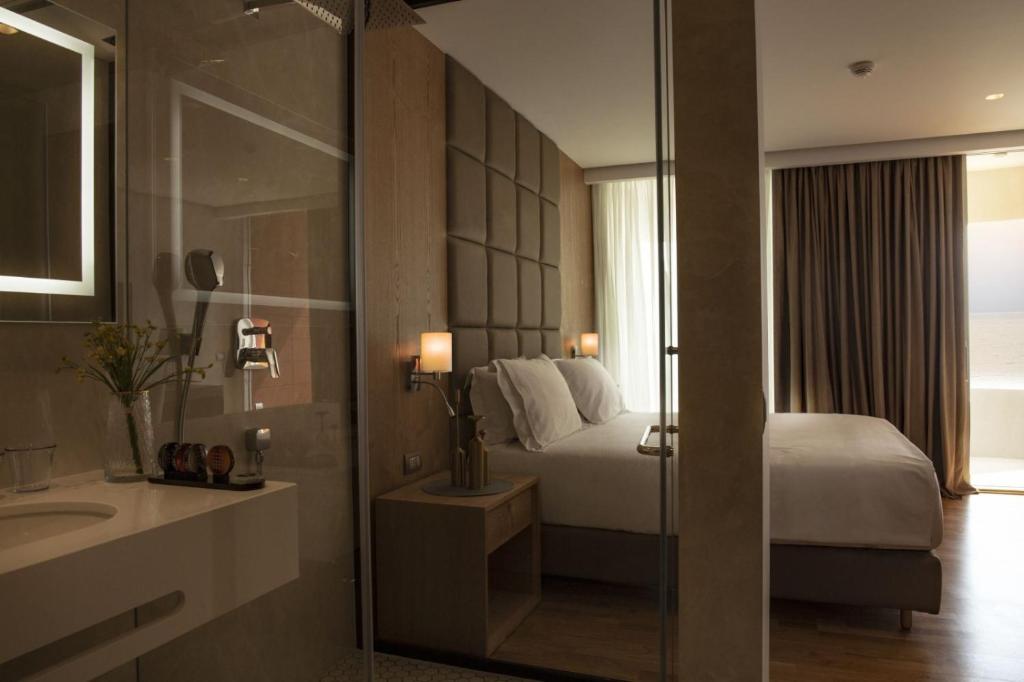 Postel nebo postele na pokoji v ubytování Amare Hotel