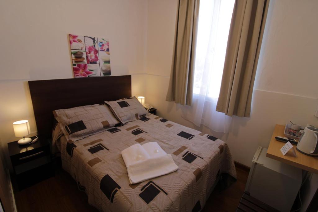 Postel nebo postele na pokoji v ubytování Hotel Mesón Do Vento