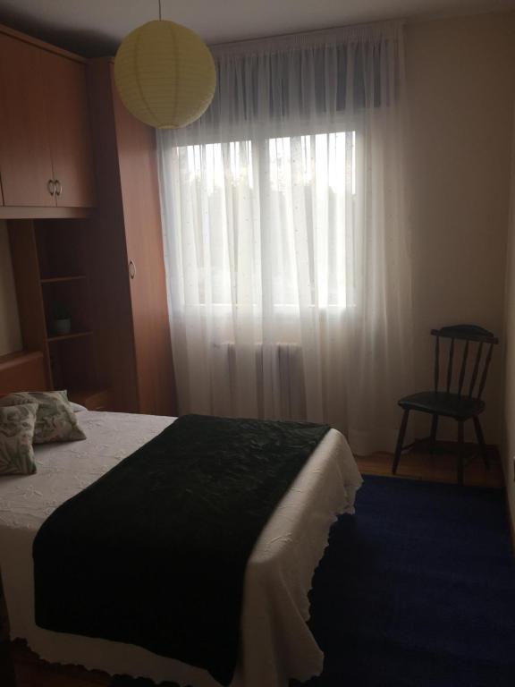 A bed or beds in a room at A CASA DE TOXO