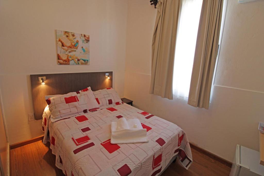 Postel nebo postele na pokoji v ubytování Hotel Mesón Do Vento