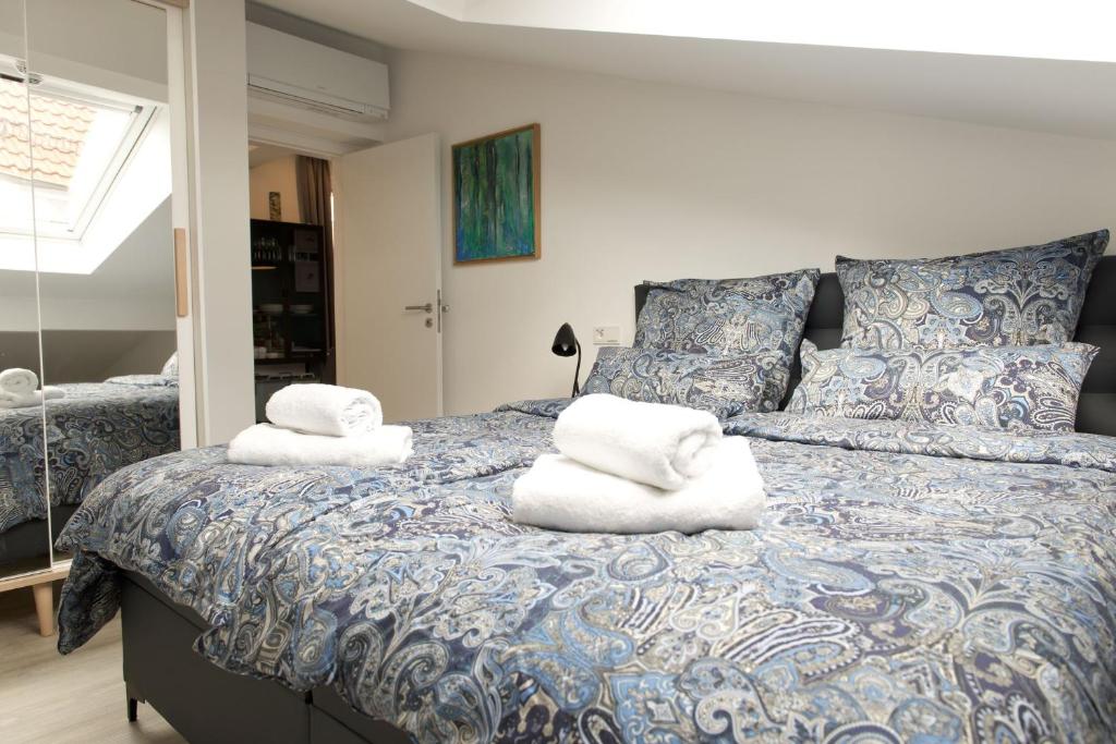 Postel nebo postele na pokoji v ubytování Apartments am Linggplatz