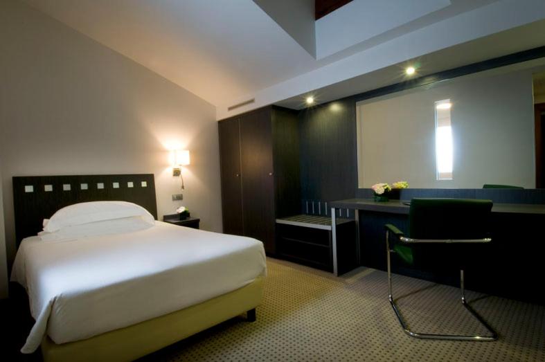 Postel nebo postele na pokoji v ubytování Arli Hotel Business and Wellness