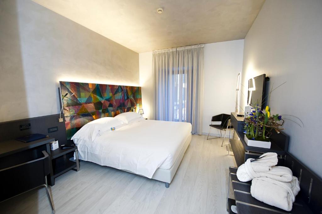 Postel nebo postele na pokoji v ubytování Arli Hotel Business and Wellness