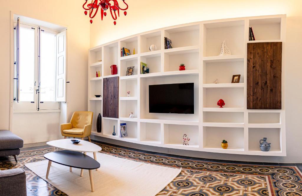 A television and/or entertainment centre at Designer Apartment