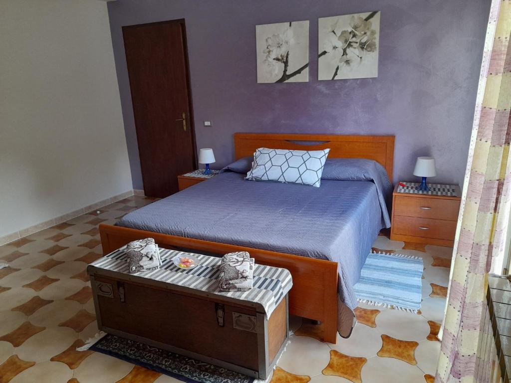 A bed or beds in a room at Appartamento Marianna