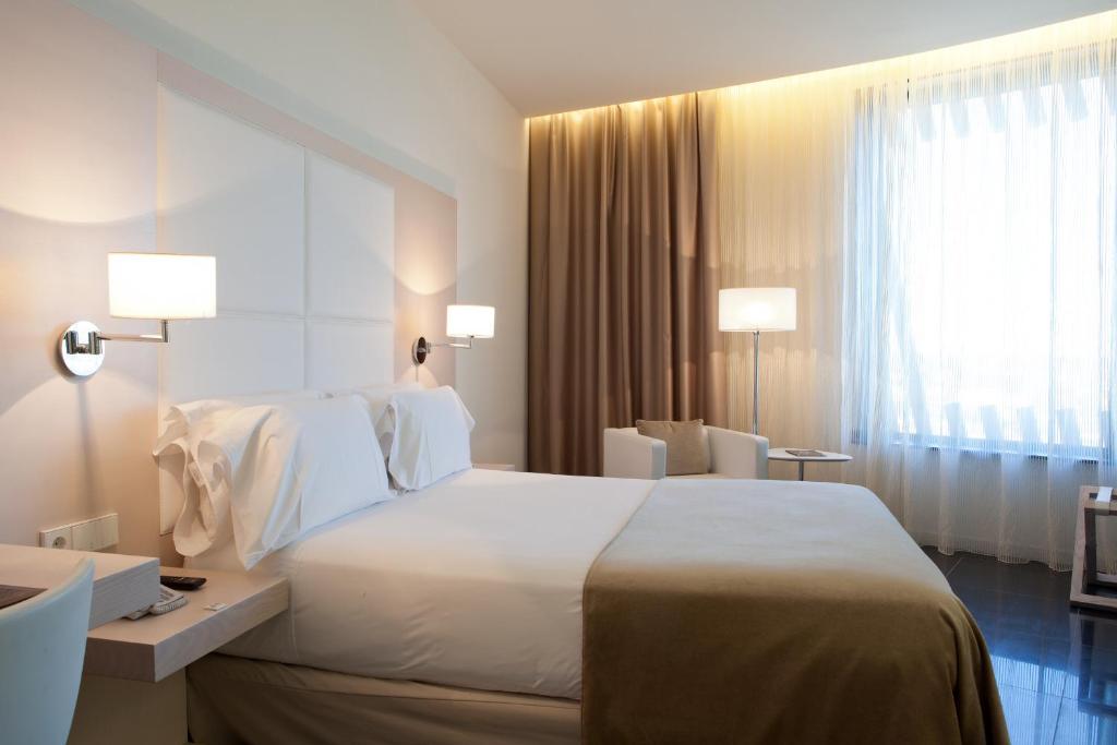 מיטה או מיטות בחדר ב-Hotel Porta Fira 4* Sup