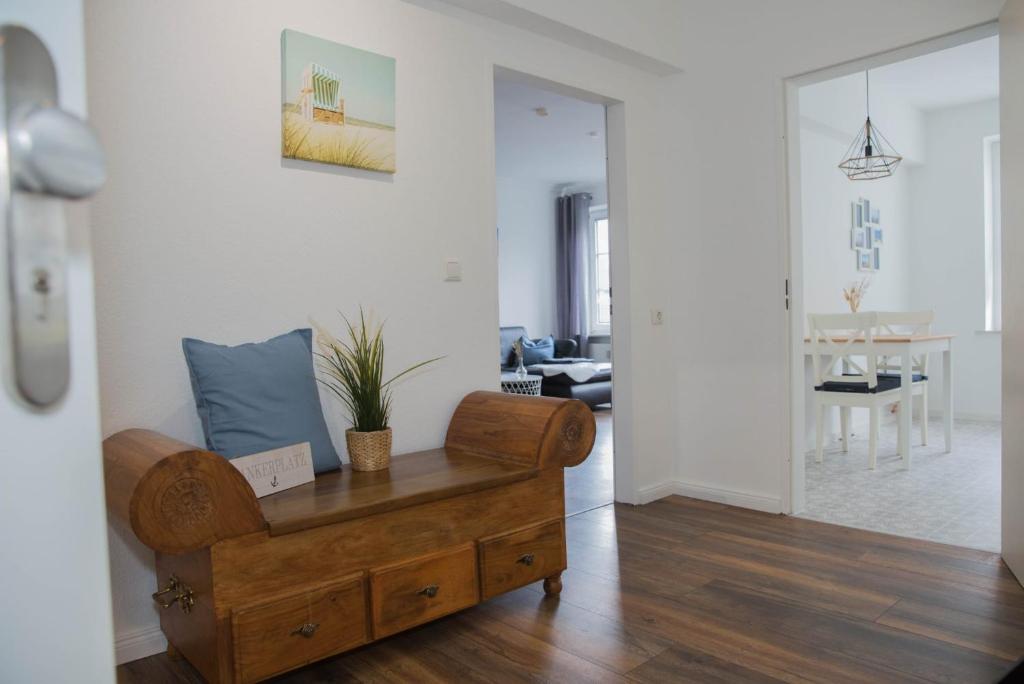 a living room with a couch and a table at Appartement Nordlicht in Eutin