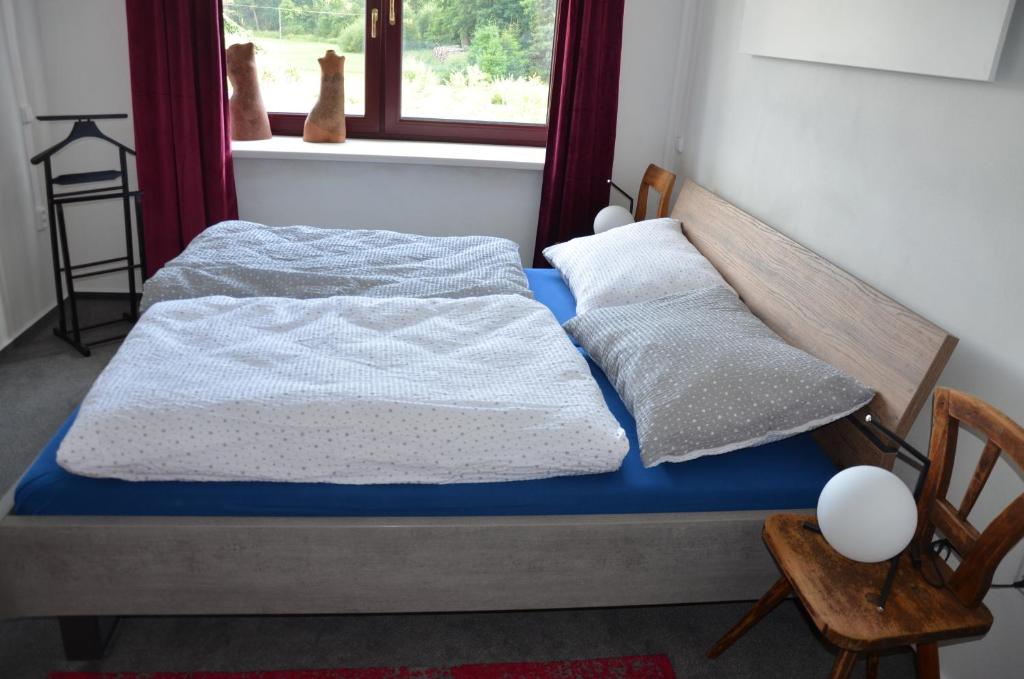 Postel nebo postele na pokoji v ubytování Apartmán Nad potokem