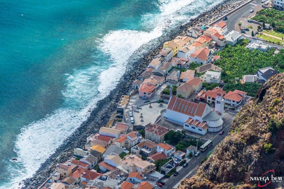 an aerial view of a village next to the ocean at Zoe House in Paul do Mar