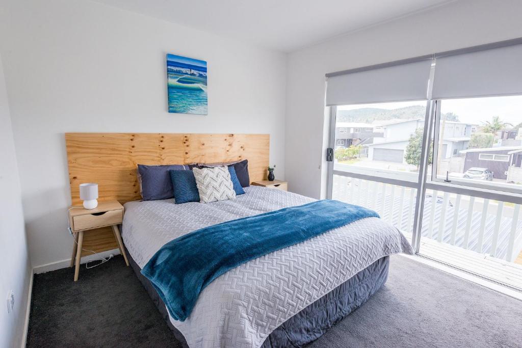 Postel nebo postele na pokoji v ubytování Surf N Stay Whangamata