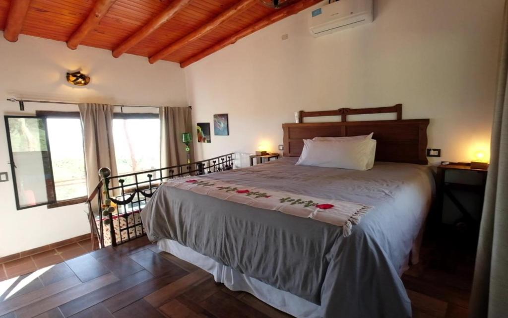 Postel nebo postele na pokoji v ubytování Tantasiña Cabañas Suites de Montaña